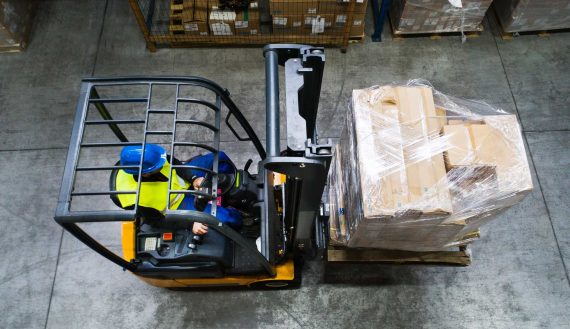 warehouse-man-worker-with-forklift-PR3WQUR.jpg